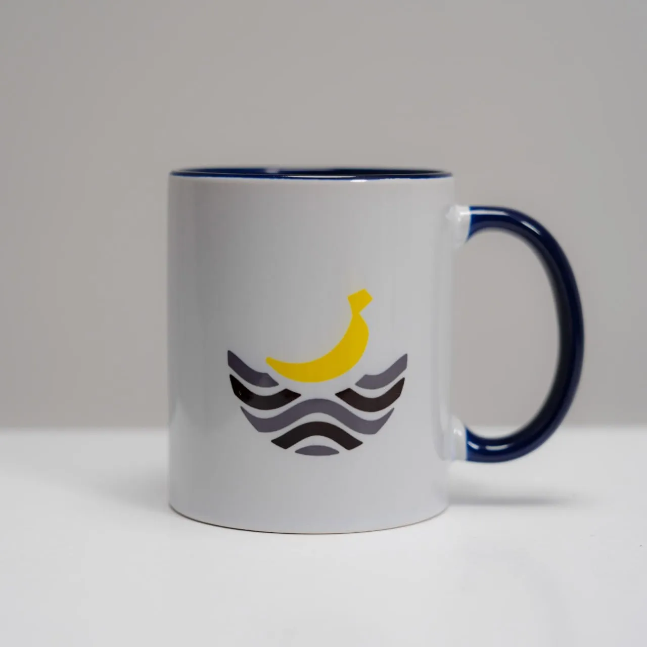 The merch mug with the banana logo